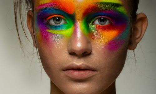 Individual placing their vote in a box.